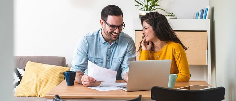 Smiling couple managing finances